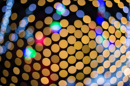 Lights blurred bokeh background from christmas night party for your design vintage or retro color tonedの写真素材