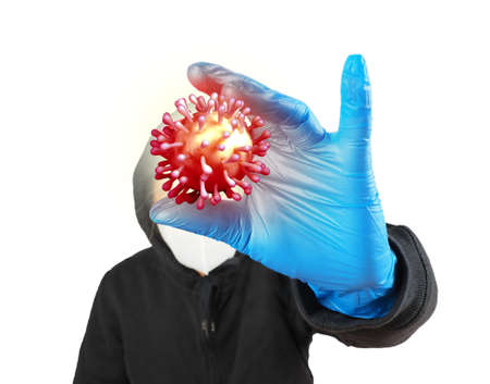 Man was defending himself and fighting the corona virus (Covid-19) and other diseases by wearing gloves and wearing a hygiene mask.の写真素材