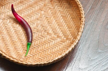 hot pepper in bamboo trayの写真素材