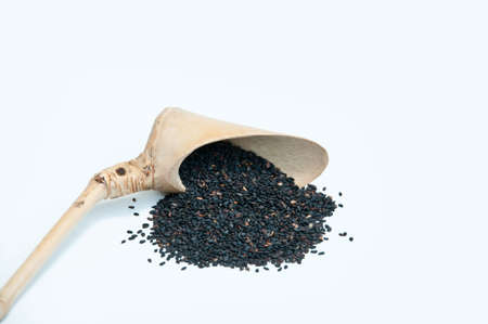 Black sesame in bamboo spoonの写真素材