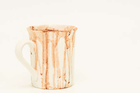 Dirty cocoa cup on white backgroundの写真素材