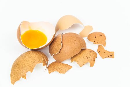 Broken eggs on white backgrounds