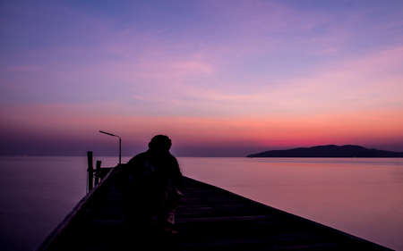 Early morning light on a wooden bridge in the sea.の写真素材