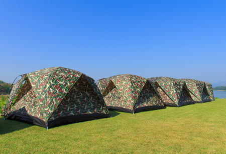 camping tent on a shore in a morning lightの写真素材