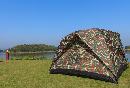 camping tent on a shore in a morning lightの写真素材