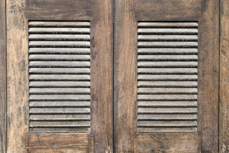 Old wooden brown house doorの写真素材