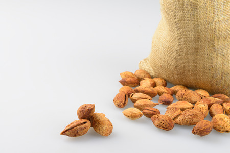 Still picture of burlap bags full with Natural Whole Almonds nutsの写真素材