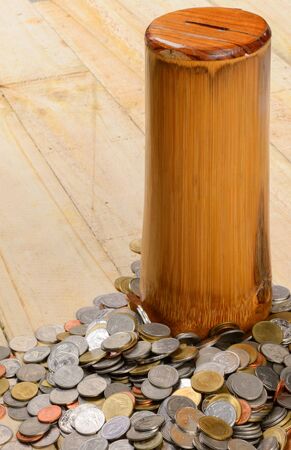 Heap of Thai Baht coins on a wooden table