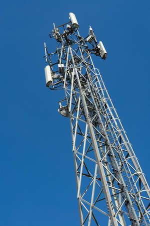 A roll of fiber-optic cables hanging from a pole. Optical fiber cable of high speed internet...