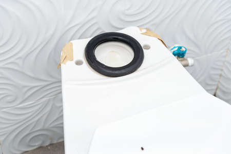 workerman performs repair of toilet bowl,  To repair the pipe from the toilet
