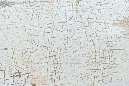 Peeling paint of old rusty car, Durable and weathered white metal surface.