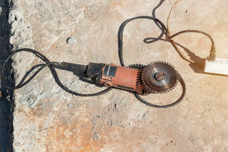 Close up Angle grinder with sanding discs on Concrete floor grinder