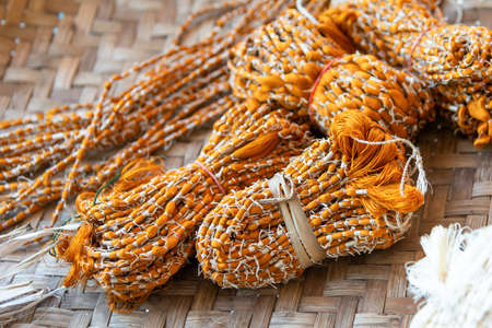 Raw silk extracted from Silk Cocoons that were produced by Silkworms.の写真素材