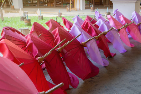 The plain colorful umbrellas are being dried for making souvenir in Chiang Mai province , Thailand.の写真素材