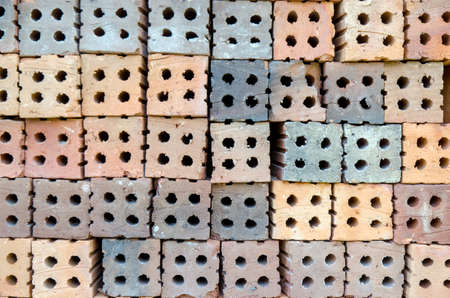 Stack of old red bricks isolatedの写真素材