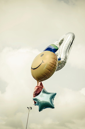 vintage heart balloon with colorful on blue sky concept of love in summer and valentine, wedding honeymoon,congratulationの写真素材