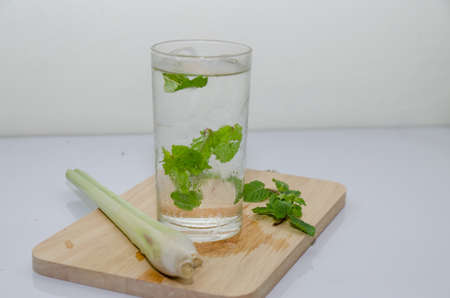 cup of green tea with mint,lemon grass,soft focusの写真素材