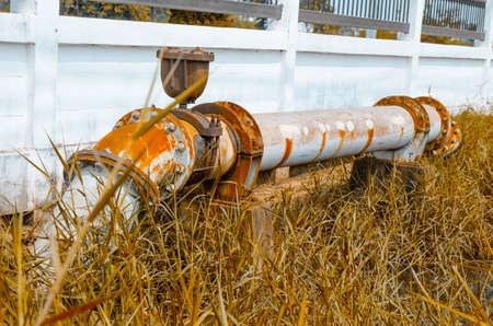 Old gate valve connects to water supply with metal pipe,vintage styleの写真素材