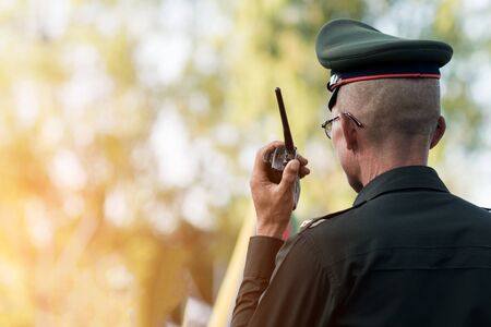 Thai police: Close up police about to talk on the radio.の写真素材