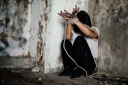 The woman is restrained and tortured , Human rights day concept.の写真素材