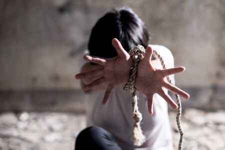The woman is restrained and tortured , Human rights day concept.