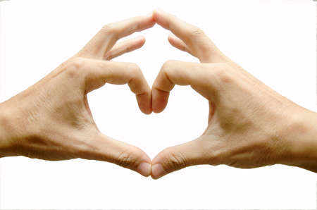 Man hands shaping a heart symbol on white backgroundの写真素材