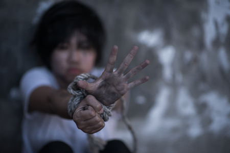 The woman is restrained and tortured, Girl help me, Human rights day concept.の写真素材