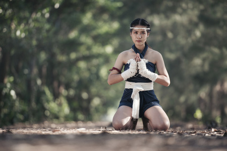 young sports woman of boxer with white boxing bandages. Fists of fighter before the fight or trainingの写真素材