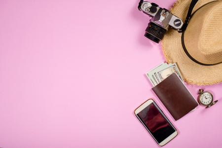 Travel accessories objects and gadgets top view flat lay on pink pastel. Travel Conceptの写真素材