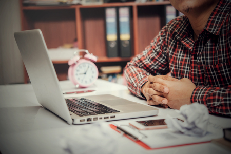 Man of unhappy businesspeople sitting in business officeの写真素材