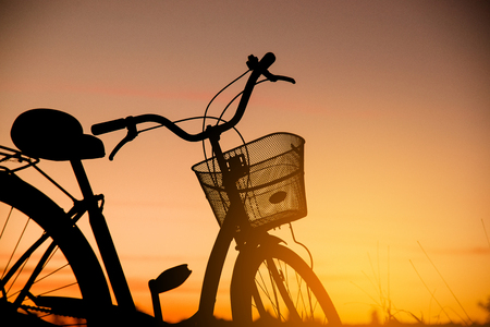 Silhouette of Vintage Bike at the sunsetの写真素材