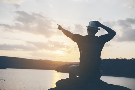Travel Young man at the sunsetの写真素材