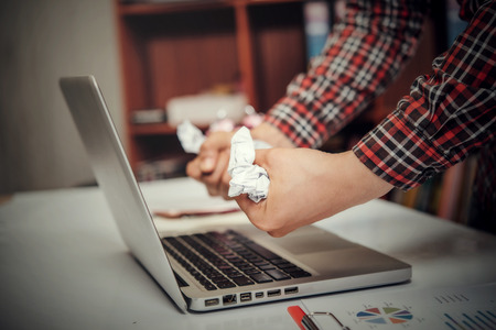 Man of unhappy businesspeople sitting in business officeの写真素材