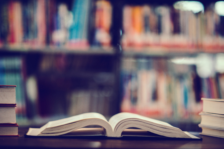 Book in library with open textbook,education learning concept