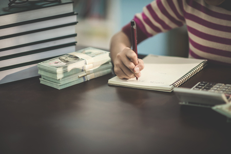 Portrait of a student child girl studying at library with money,
Mathematics Learning Conceptの写真素材
