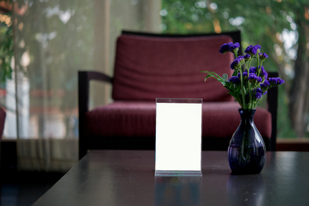Mock up Menu frame standing on wood table in hotelの写真素材