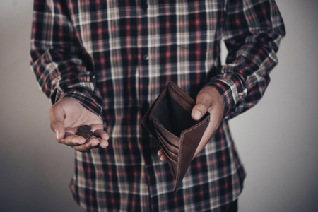 businessman saving money, Close up man carrying a wallet in hand, the dollar,finance accounting conceptの写真素材