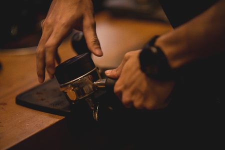 Barista make coffee with espresso machine in cafe vintage color toneの写真素材