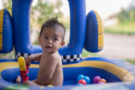 Little boy happy with kid poolの写真素材