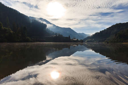 reflections on the lake at a sunriseの写真素材