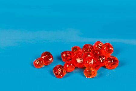 red salmon roe isolated on blue background の写真素材