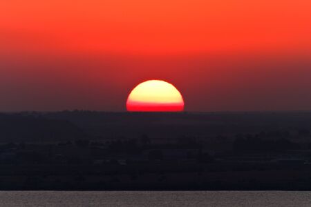 a beautiful sunset over the hill