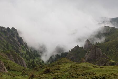 mountains and clouds in Ciucas Mountains, Romaniaの写真素材