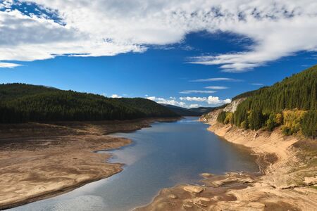 mountain lake and a blue sky with cloudsの写真素材