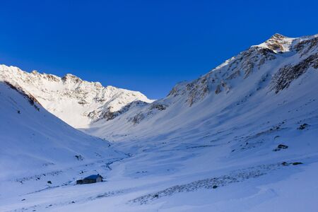 winter mountain landscape with a blue sky, Fagaras Mountains, Romaniaの写真素材