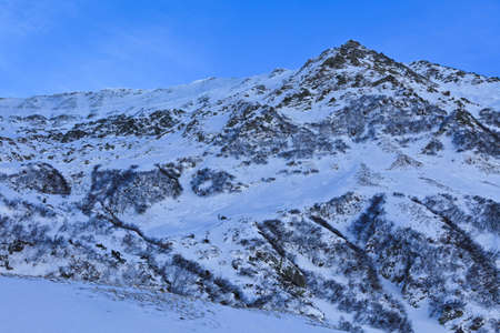 winter mountain landscape with a blue sky, Fagaras Mountains, Romania