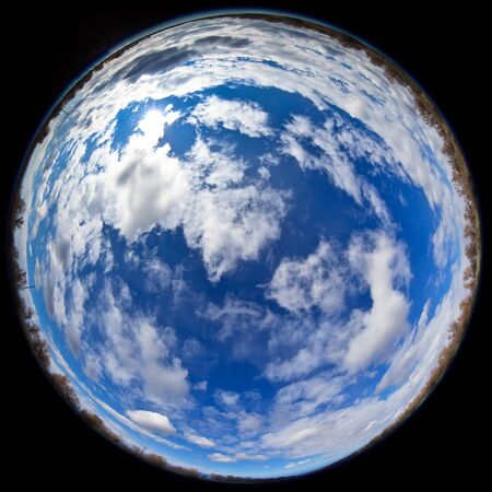 fisheye lens image of blue sky with clouds 