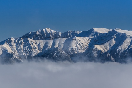 winter landscape with a mountain background. Bucegi Mountains, Romaniaの写真素材