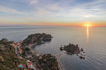 Isola Bella beach coast at sunrise. Taormina, Italyの写真素材