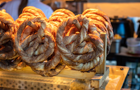 Close up of puff pastry pretzels with brown sugar and cinnamon in small bakery store. small business.の写真素材